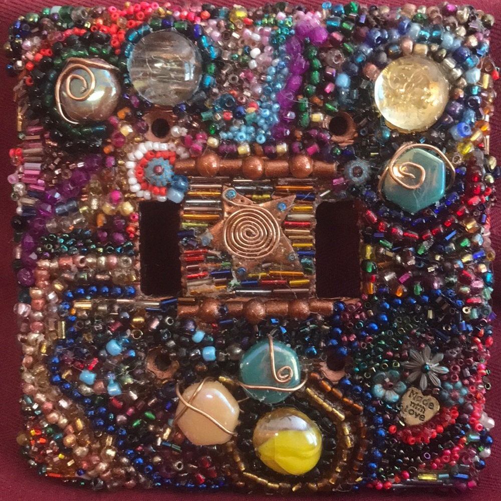 Double handmade beaded ceramic light switch cover.